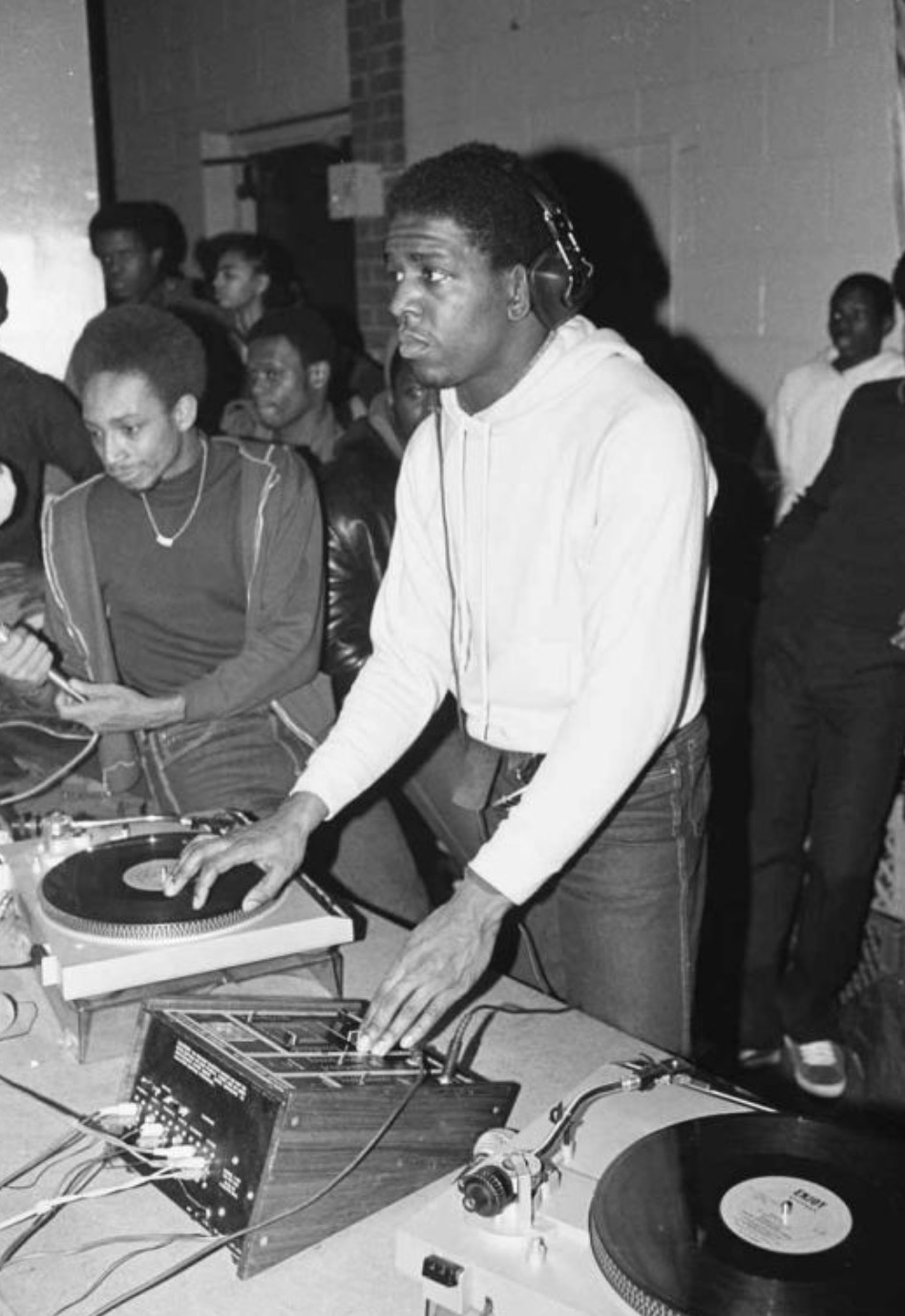 A young Red Alert and DJ Tony Tone scratching records 